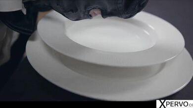 Little Caprice has cuffed and hooded sub lapping bowl while she fingers