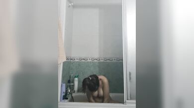 University girl in shower washes and shaves
