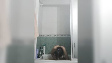University girl in shower washes and shaves