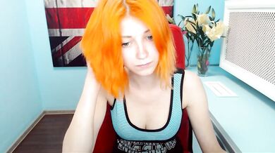 Bright orange haired camgirl strips and plays smoking a cigarette