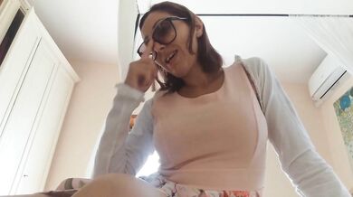 Brunette camgirl in glasses fingers her pussy closeup